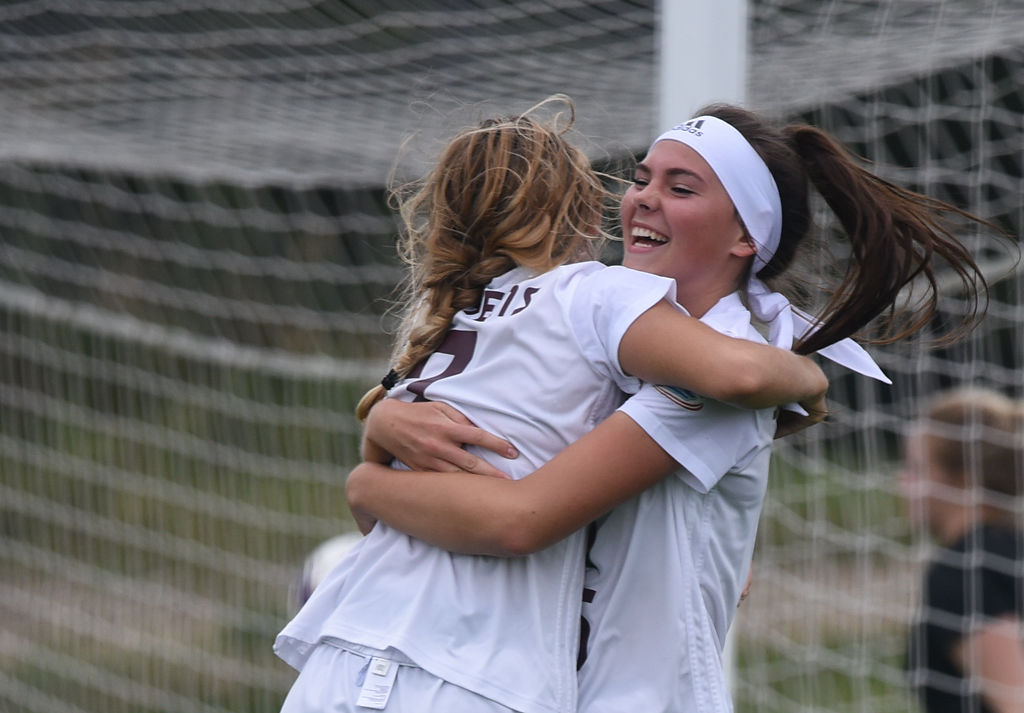 Anya Castelli and Peyton Lane celebrate after Castelli scores Stephens' second goal